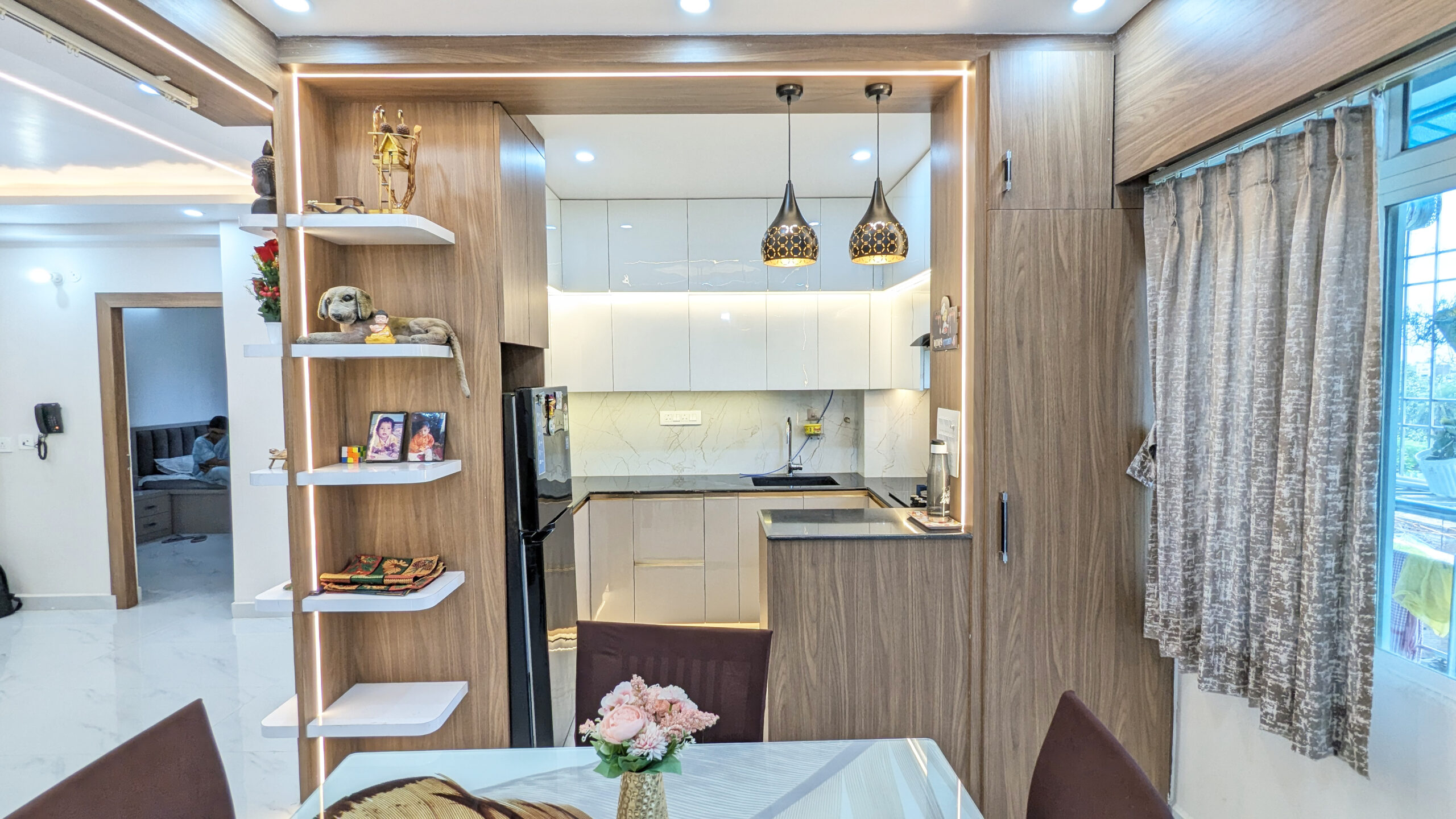 Modern modular kitchen interior with overhead cabinets and premium hardware designed by Interior Bee in Patna